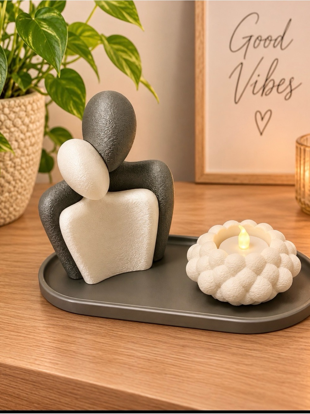 Decorative Embrace Sculpture with White Candle Accent